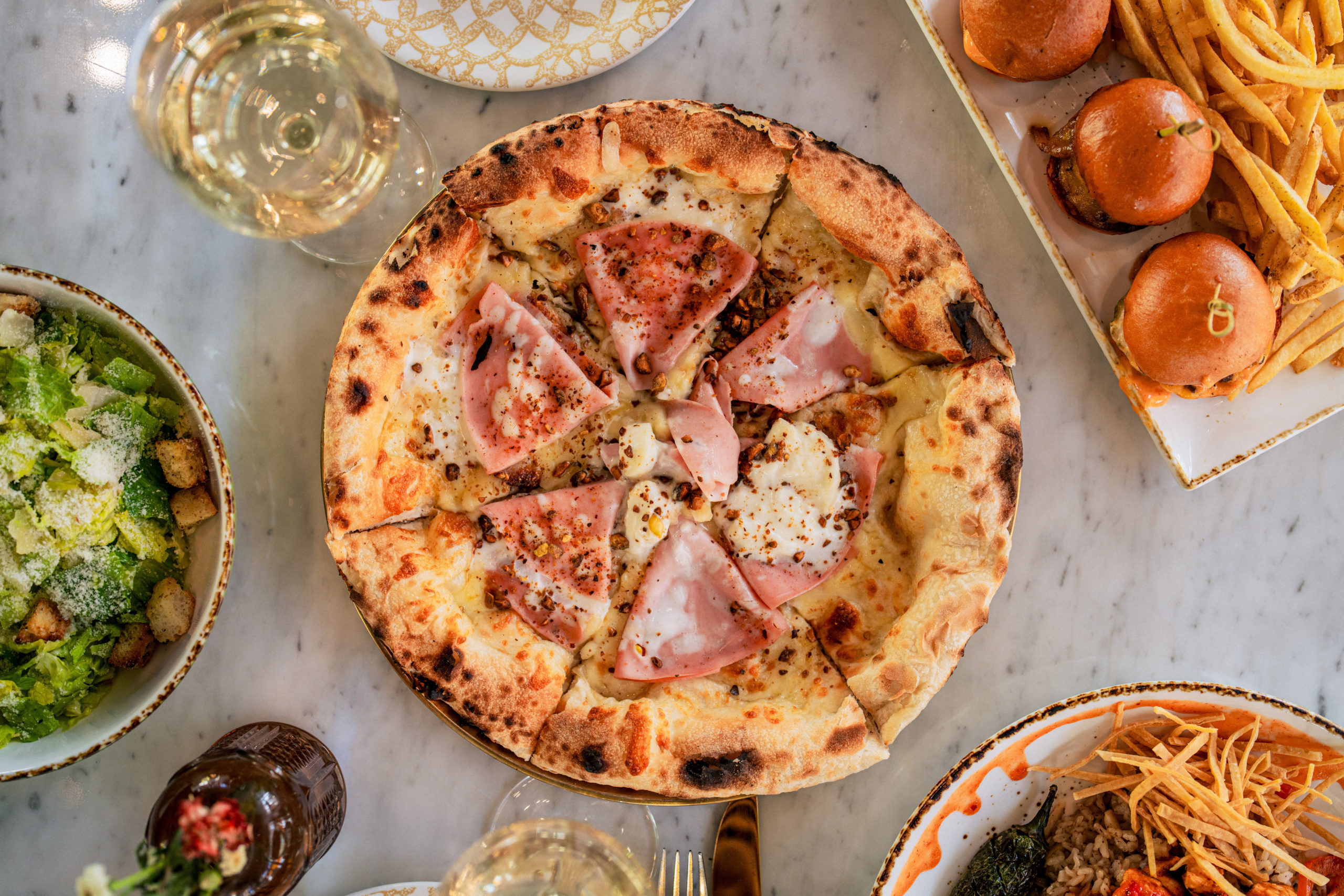 Pizza, pasta and Caesar salad at Olia in Glendale
